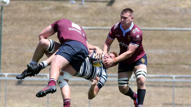 Rugged Uni defence. Picture by Richard Gosling