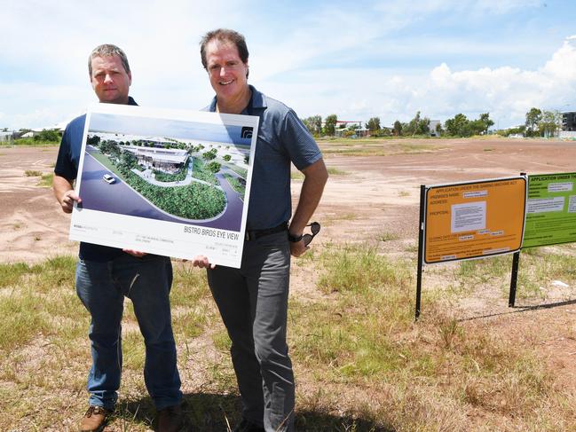 Steve Dugan and Justin Coleman with an artist impression of a proposal for Breezes in Muirhead. Picture Katrina Bridgeford.