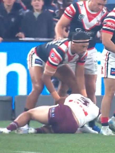 Roosters players rushed to Koula's aid. Photo: Fox Sports