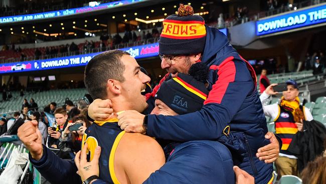 Taylor Walker of the Crows celebrates with fans after Saturday’s Showdown win at Adelaide Oval. Picture: Daniel Kalisz/Getty Images