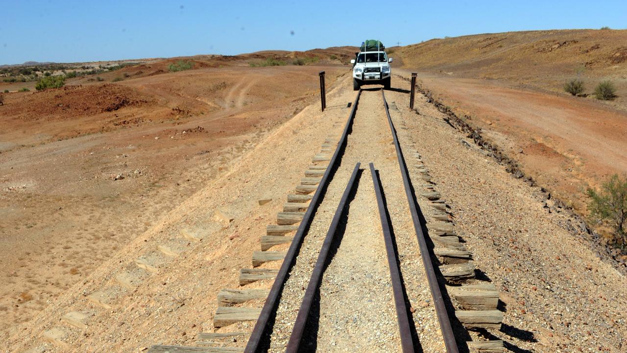 NT Police righted a vehicle after it rolled on a train track 200km south of Alice Springs.