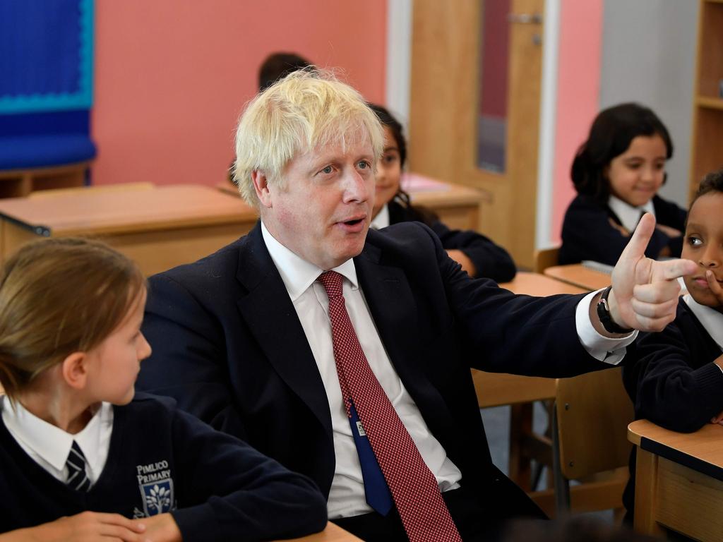 Britain's Prime Minister Boris Johnson attends a history class with pupils during a visit to a primary school in London. Picture: AFP