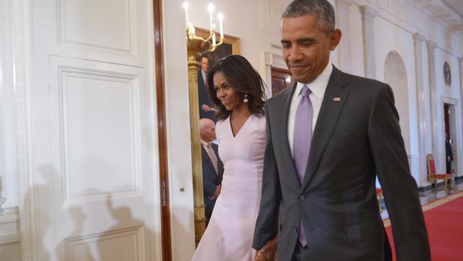 US President Barack Obama and First Lady Michelle Obama whose style is a mix of high street and high-end designers. Picture: AFP