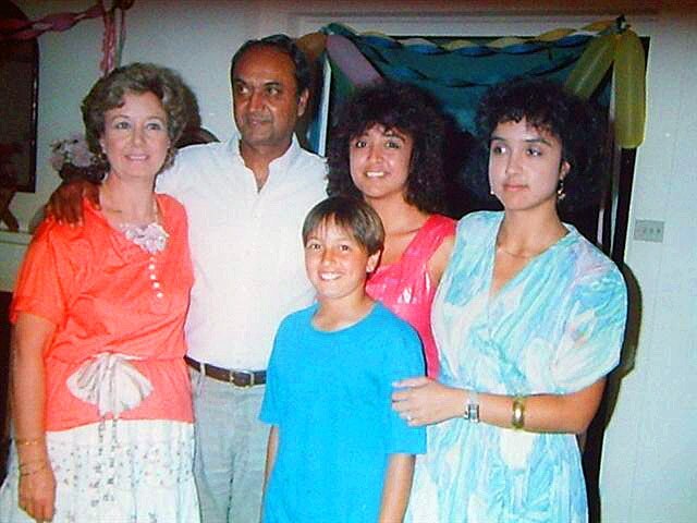 Wentworth MP Dave Sharma as a child with his late parents Diana and Bholan and his twin sisters Melanie and Belinda.