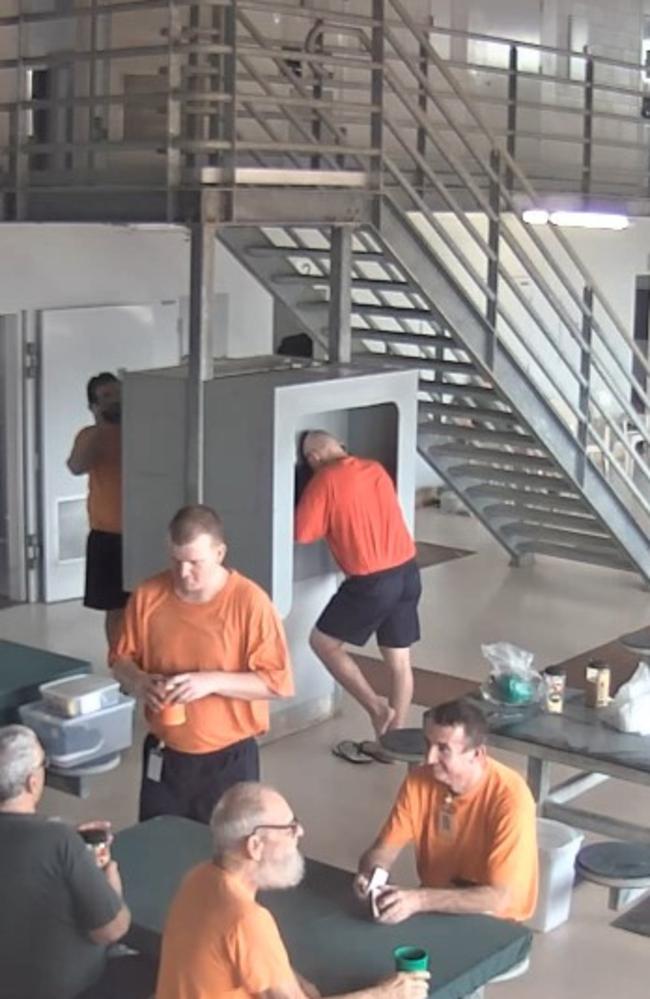 Ben Hoffmann on the phone at Holtze Prison before he allegedly splashed coffee on a fellow prisoner in November 2021. Picture: NT Courts