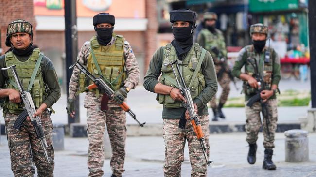 Indian soldiers at a market in Srinagar in Indian-controlled Kashmir. Picture: AP
