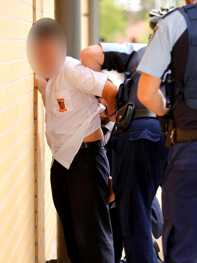 A student was handcuffed. Picture: John Grainger