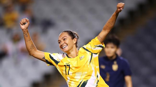 Simon celebrates scoring one of her 26 goals in national team colours.