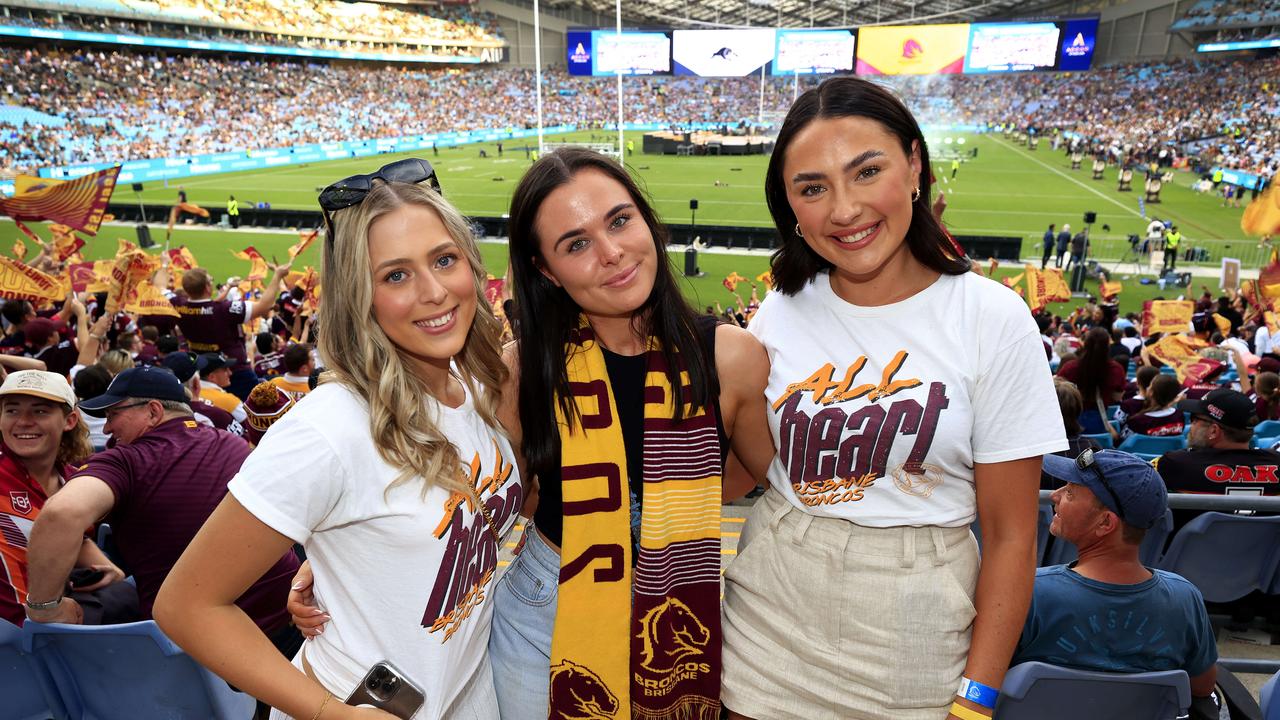 Georga Boegheim, Alexandra Dalton, and Lily Cubby from Brisbane get ready for the NRL Grand Final at Accor Stadium, Sydney Olympic Park. Pics Adam Head