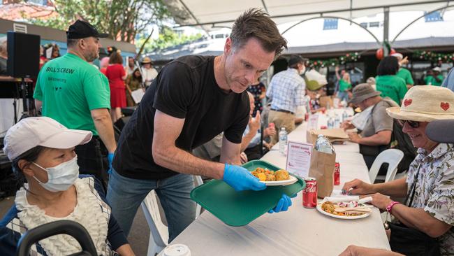 NSW Premier Chris Minns serves lunch to the needy at The Reverend Bill Crews Foundation in Ashfield, Sydney. Picture: NCA NewsWire / Flavio Brancaleone