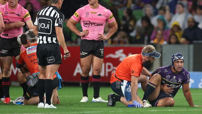 Hughes (right) and Cleary (second left) receive treatment after the collision. (Photo by Daniel Pockett/Getty Images)