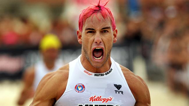 Ironman Matt Poole crosses the finish line in winning the Nutri-Grain Ironman event at Bondi Beach in Sydney.