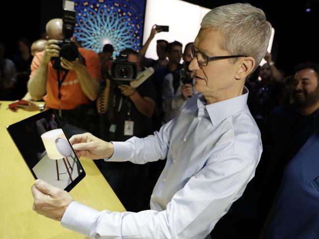 Apple CEO Tim Cook shows an iPad Pro during an announcement of new products at the Apple Worldwide Developers Conference. Picture: Marcio Jose Sanchez