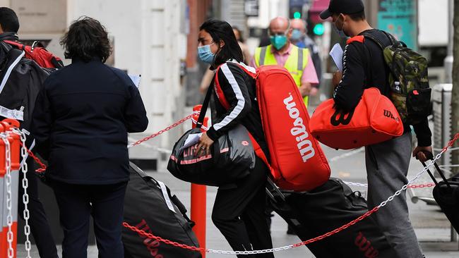 Tennis players and officials arrive at the Grand Hyatt hotel for a two-week quarantine ahead of the Australian Open. Picture: AFP.