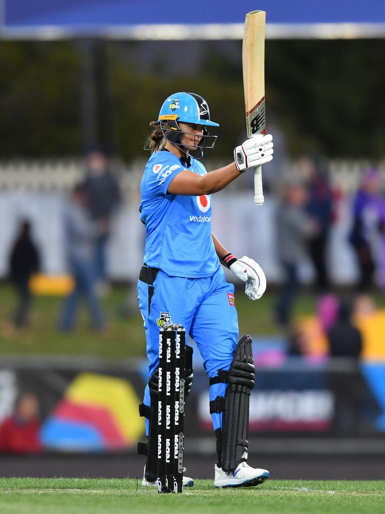 Suzie Bates, captain of the Adelaide Strikers raises her bat after scoring 50 runs during the WBBL against the Hobart Hurricanes at Blundstone Arena in Hobart. Picture: AAP IMAGE/DAVID MARIUZ