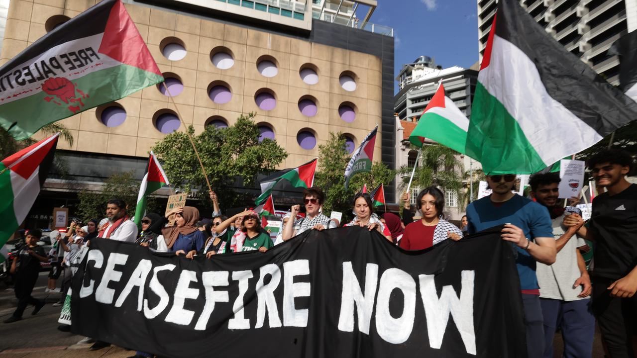 Palestinian Supporters march through Brisbane calling for a ceasefire from Israel. Picture Lachie Millard