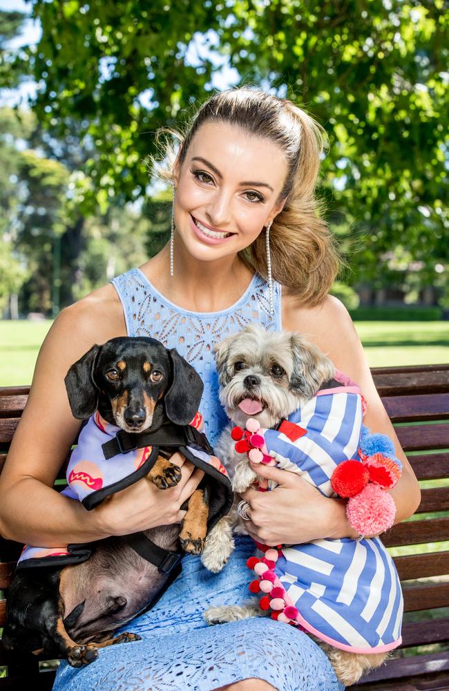 Model Alex Hecker with Harry and Maisey in designer outfits. Picture: Tim Caraffa