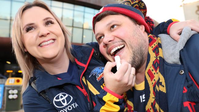 Tamra Osborne and Joshua Fenn on their way into Adelaide Oval. Picture: Dean Martin