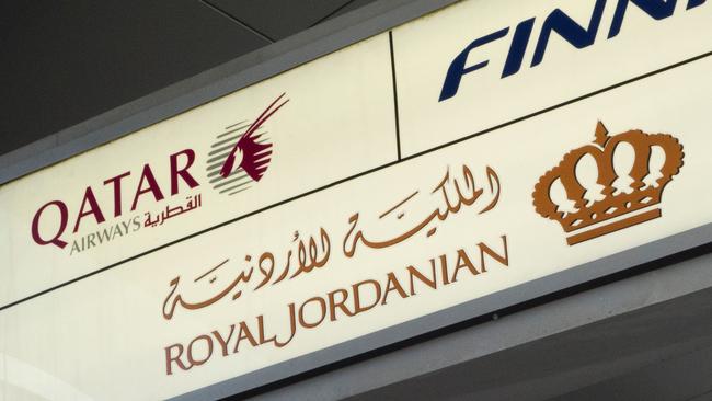 A sign marks the check-in for Qatar Airways, Royal Jordanian Airlines and Finnair on March 21, 2017 at John F. Kennedy International Airport in New York.  Passengers traveling to the United States from 10 airports in eight Muslim-majority countries will be prohibited from bringing laptops, tablets and other portable electronic devices on board with them when they fly. The nine airlines affected by the US ban are Royal Jordanian, EgyptAir, Turkish Airlines, Saudi Arabian Airlines, Kuwait Airways, Royal Air Maroc, Qatar Airways, Emirates and Etihad Airways. / AFP PHOTO / DON EMMERT