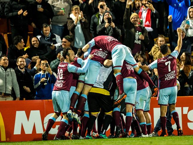 Tigers players react after their win in the FFA Cup Round of 16 match between the Apia Leichhardt Tigers FC and Melbourne Victory at Leichhardt Oval in Sydney, Tuesday, August 21, 2018. (AAP Image/Brendan Esposito) NO ARCHIVING, EDITORIAL USE ONLY
