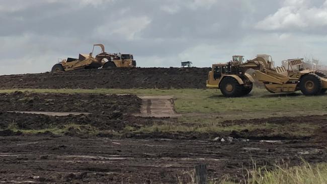 Bulldozers start to prepare the land for the housing estate.