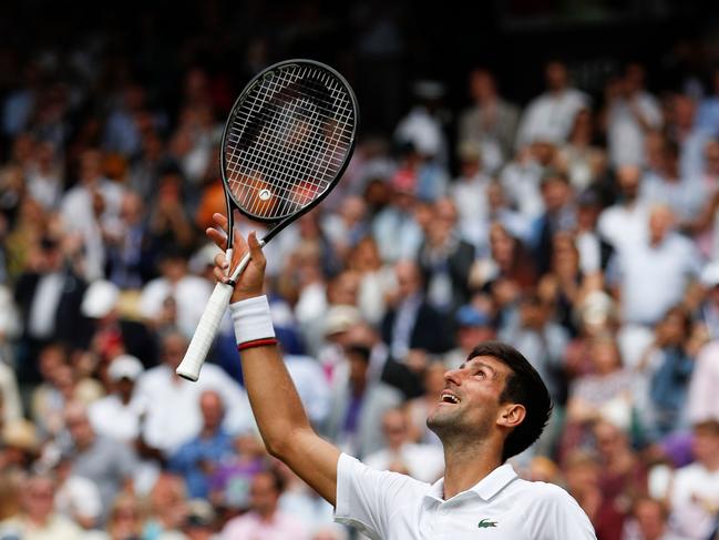 Serbia's Novak Djokovic celebrates beating Belgium's David Goffin during their men's singles quarter-final match on day nine of the 2019 Wimbledon Championships at The All England Lawn Tennis Club in Wimbledon, southwest London, on July 10, 2019. (Photo by Adrian DENNIS / AFP) / RESTRICTED TO EDITORIAL USE