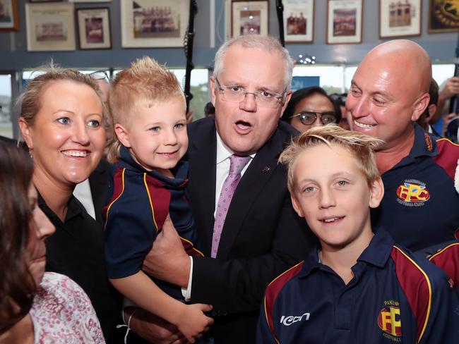 The PM makes new friends during a visit to the Pakenham Football club in Melbourne’s south-east. Picture:  Gary Ramage