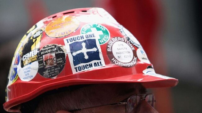 A union member with stickers on his hardhat, including the Eureka flag.