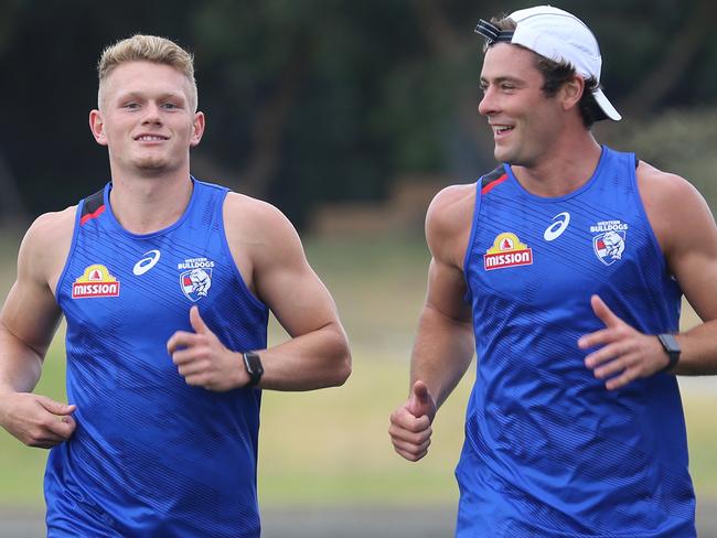 Adam Treloar and Josh Dunkley run laps at Whitten Oval on Wednesday, December 16. Picture: WESTERN BULLDOGS