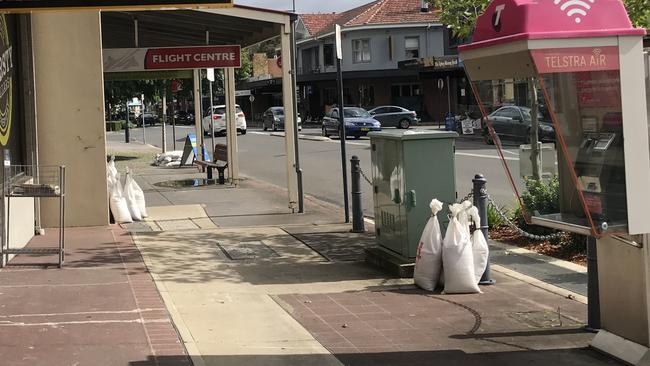 Businesses along Picton's main street are putting their sandbags out for collection after the town had a near miss with the floods. Picture: Adelaide Lang