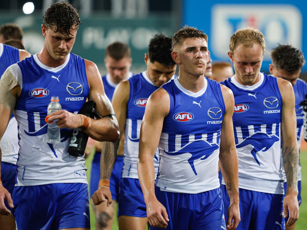 DARWIN, AUSTRALIA - MAY 11: The Kangaroos look dejected as they leave the field after the 2024 AFL Round 09 match between the Gold Coast SUNS and North Melbourne Kangaroos at TIO Stadium on May 11, 2024 in Darwin, Australia. (Photo by Dylan Burns/AFL Photos)