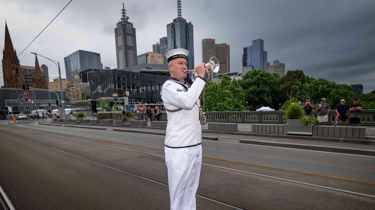 Six buglers will be stationed around the Melbourne CBD at 11am to play the Last Post marking Remembrance Day. Leading Seaman Musician Cam McAllister from HMAS Cerberus plays the Last Post accompanied with COL Jason Cooke on the Princess Bridge. Picture: Tony Gough