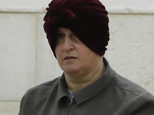 Malka Leifer, a former Australian teacher accused of dozens of cases of sexual abuse of girls at a school, arrives for a hearing at the District Court in Jerusalem on February 27, 2018, Israel on February 12 arrested the Australian woman who is wanted in her home country on child sex abuse charges, police announced. The suspect has been living in a West Bank settlement for the past decade following a complaint filed against her by a former student at a Jewish ultra-Orthodox school she ran in Melbourne.  / AFP PHOTO / AHMAD GHARABLI