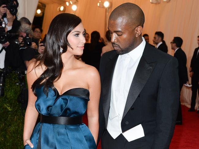 Admiring glance: Kim Kardashian and Kanye West attend the “Charles James: Beyond Fashion” Costume Institute Gala at the Metropolitan Museum of Art in New York City. Picture: Getty