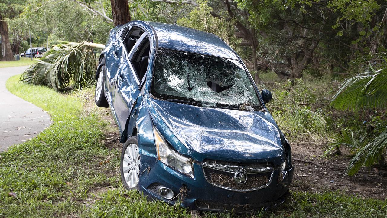 A car washed up next to Little Cabbage Tree Creek in Aspley, Brisbane. Picture: Nigel Hallett