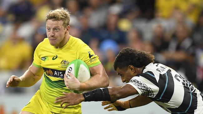 TOWNSVILLE, AUSTRALIA - JUNE 26: Lachlan Miller of Australia runs the ball during the Oceania Sevens Challenge match between Fiji and Australia at Queensland Country Bank Stadium on June 26, 2021 in Townsville, Australia. (Photo by Ian Hitchcock/Getty Images)