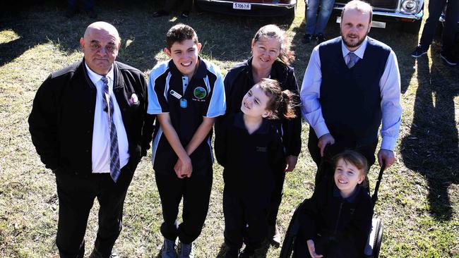 Rattle &amp; Hum founder Tony Outal (left) and Tallowood principal Greg Wood (right) with Tallowood students. Picture: Angelo Velardo