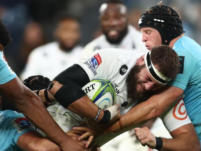 SYDNEY, AUSTRALIA - APRIL 27: Thomas du Toit of the Sharks Is tackled during the round 11 Super Rugby match between the Waratahs and Sharks at Bankwest Stadium on April 27, 2019 in Sydney, Australia. (Photo by Mark Metcalfe/Getty Images)