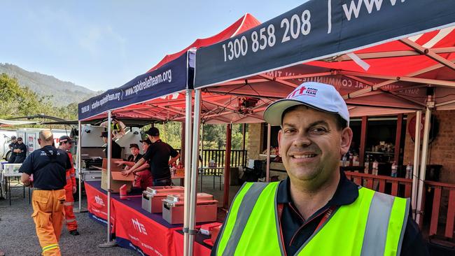 Rapid Relief Team (RRT) state team leader Daryl Muller and his volunteers feeding firefighters at Canungra Sports and Recreation Ground. Picture: Luke Mortimer