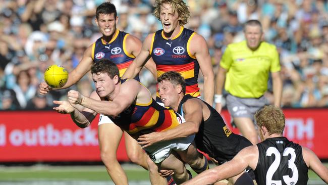 Footy returns to the Oval for the first time in decades. Brad Ebert tackles patrick Dangerfield during the Round 2 AFL match between Port Adelaide and the Crows at Adelaide Oval in Adelaide, Saturday, March 29, 2014. Photo: AAP Image/David Mariuz.