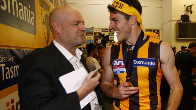 Mark Robinson chats to Issac Smith in the Hawthorn rooms. Picture: Wayne Ludbey