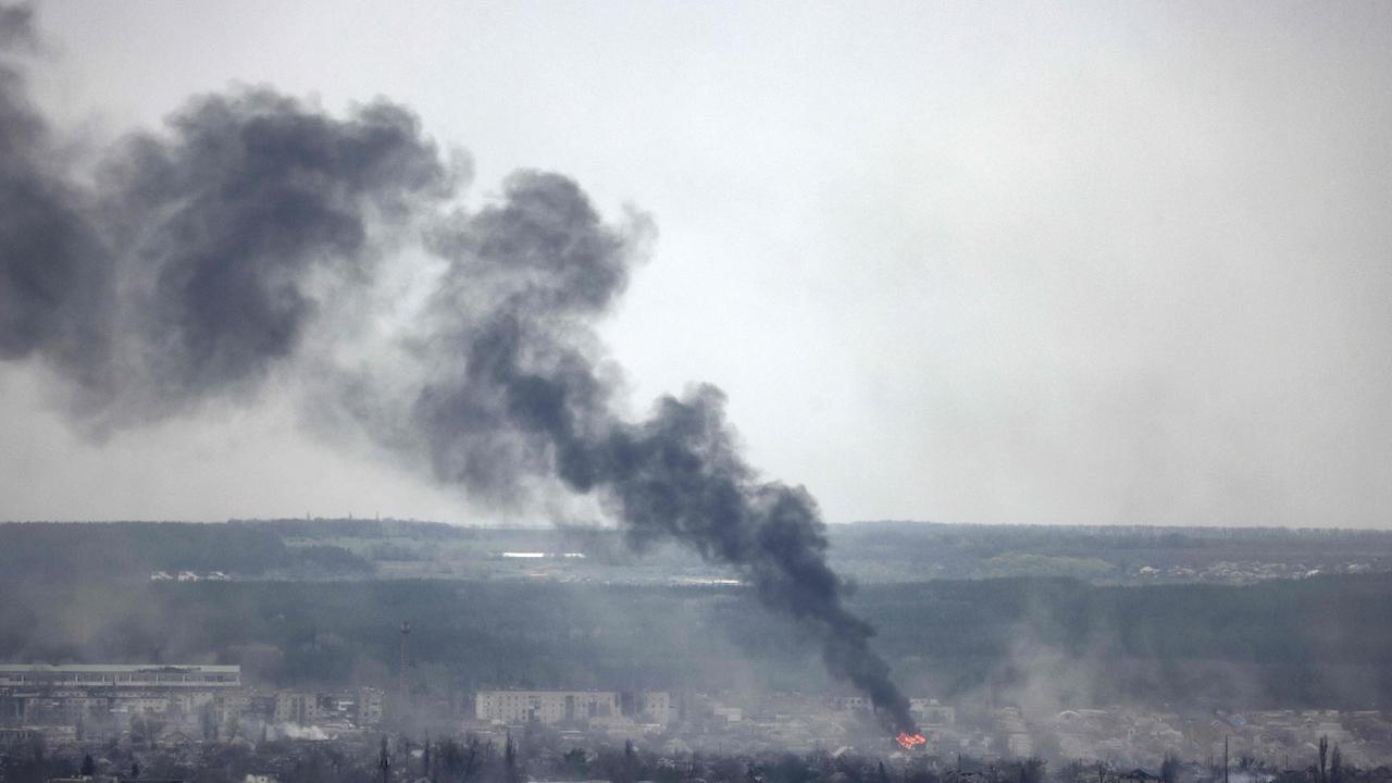 A photograph taken from Novodruzhesk village, shows dark smoke rising in Rubizhne city, on April. Picture: Ronaldo Schemidt/AFP