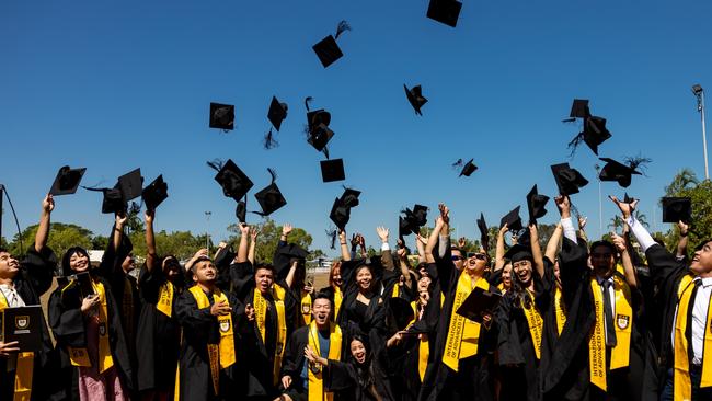 Students from Darwin’s International College of Advanced Education celebrate their graduation last May.