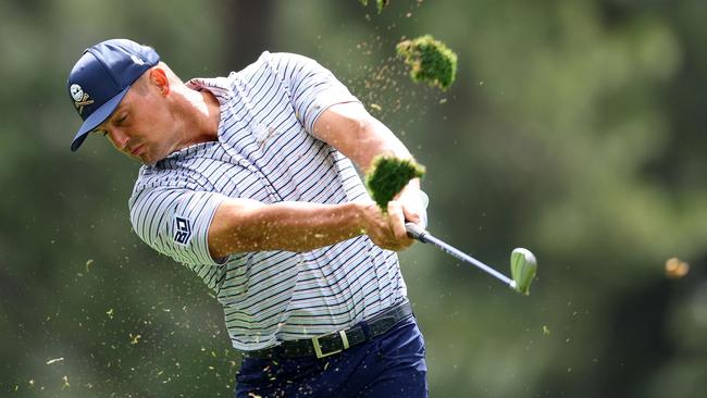 Bryson DeChambeau plays his shot from the fourth tee during his seven-under 65. Picture: Getty Images