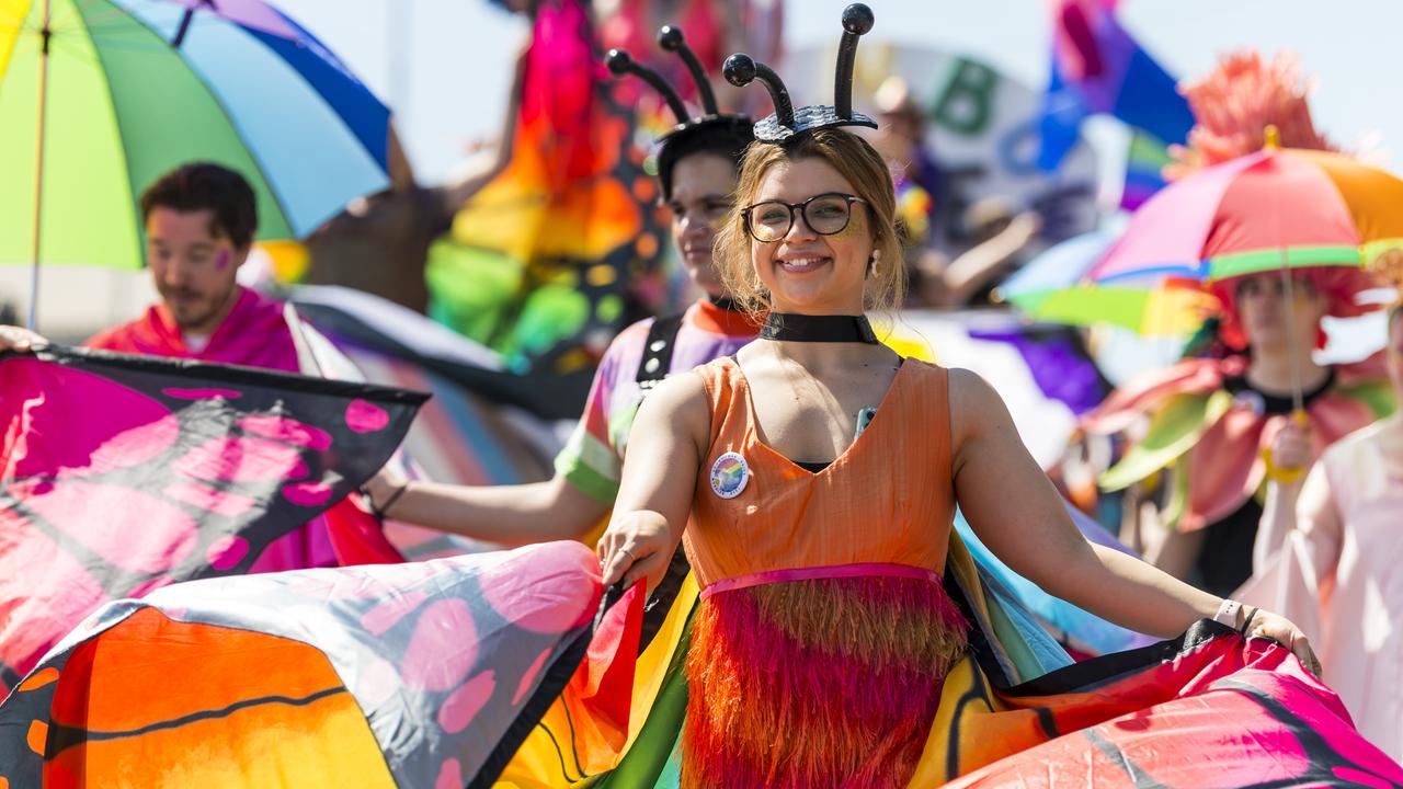 Rachel Menkins with the LGBTIQA+ Rainbow Pride float of the Carnival of Flowers floral parade. Picture: Kevin Farmer