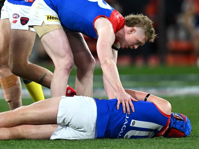 MELBOURNE, AUSTRALIA - SEPTEMBER 07: Angus Brayshaw of the Demons lays on the ground knocked out during the AFL First Qualifying Final match between Collingwood Magpies and Melbourne Demons at Melbourne Cricket Ground, on September 07, 2023, in Melbourne, Australia. (Photo by Quinn Rooney/Getty Images)