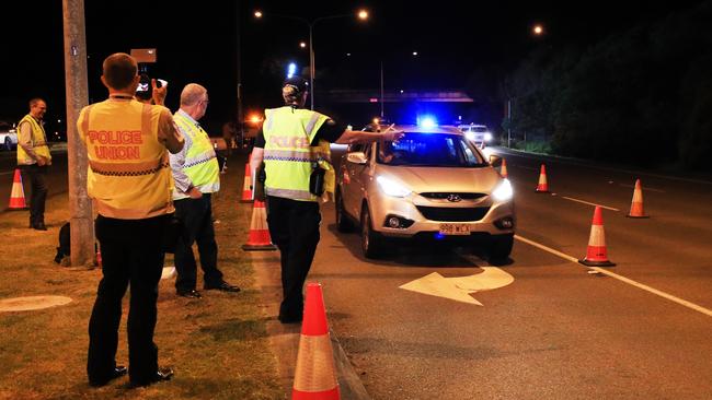 Queensland Police set up a road block at Coolangatta at the NSW border, as non-essential crossings are limited. Picture: Scott Powick