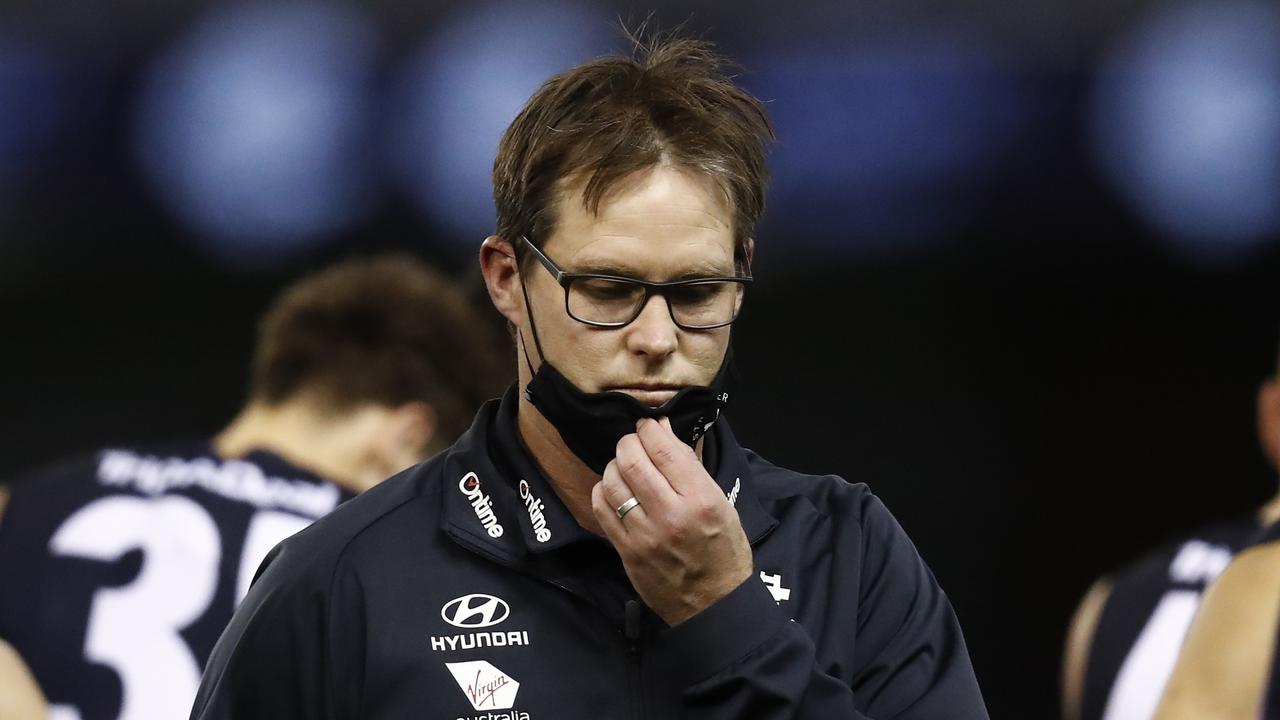 MELBOURNE, AUSTRALIA - JULY 24: David Teague, senior coach of Carlton walks from the 3/4 time huddle during the round 19 AFL match between Carlton Blues and North Melbourne Kangaroos s at Marvel Stadium on July 24, 2021 in Melbourne, Australia. (Photo by Darrian Traynor/Getty Images)