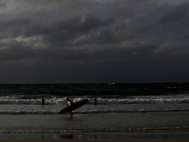 People enjoy an early morning swim as clouds hover over Bondi Beach, Bondi, Sydney, Australia, 04 March 2017. Photo by Brianne Makin