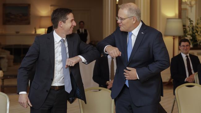 Simon Birmingham greets Prime Minister Scott Morrison at Government House in Canberra. Picture: Sean Davey